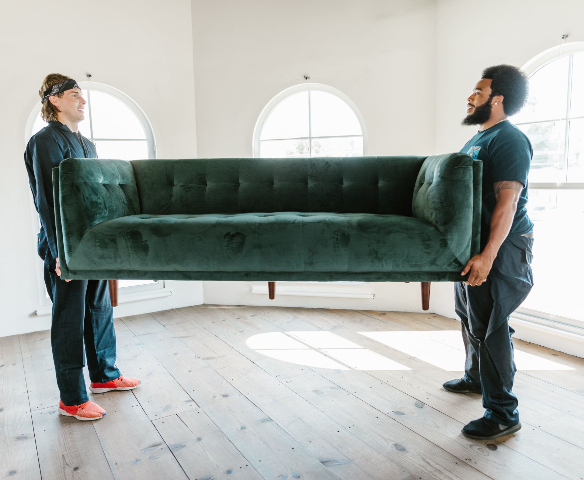 Close-Up Shot of Men Carrying a Couch